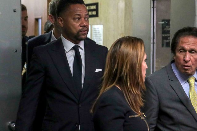 Cuba Gooding Jr., left, follows his legal team from court after he pleaded not guilty to sexual misconduct charges in New York on Tuesday.